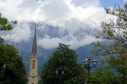 church spire with mountains